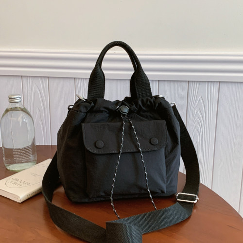 包包高質感新款水桶包韓版尼龍布小包時尚百搭休閒抽繩手提斜後後背包