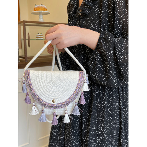 波西米亞風草編包2025夏季新款編織手拿包流蘇水桶包單肩斜背女包
