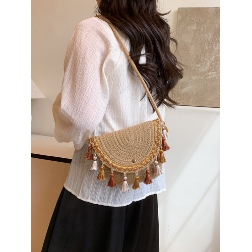 波西米亞風草編包2025夏季新款編織手拿包流蘇水桶包單肩斜背女包