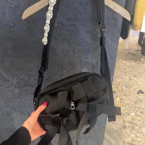 款休閒潮酷甜禧辣妹包珍珠蝴蝶結單肩斜後後背包包多口袋女迷彩打歌服