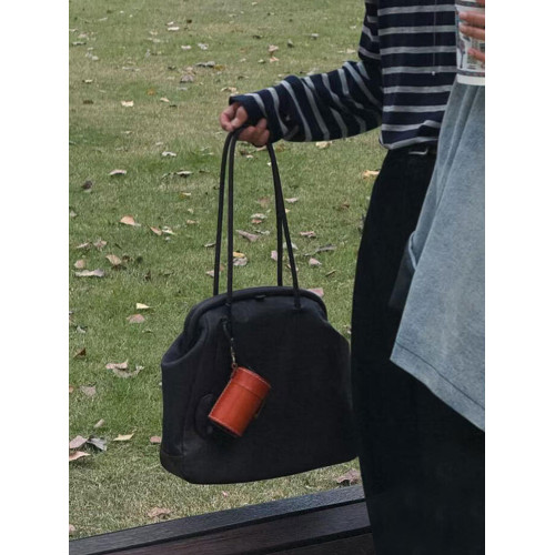 單肩腋下黑色貝殼夾子包包女式2026新款輕奢小衆高級感手提托特包