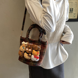 兒童斜後後背包手提水桶包女2025新款秋冬流行可愛斜後後背包小貓咪手拎包