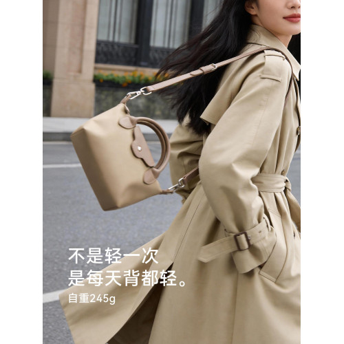 音樂家新款尼龍通勤斜後後背包女士百搭餃子包輕便實用手機雜物小包包