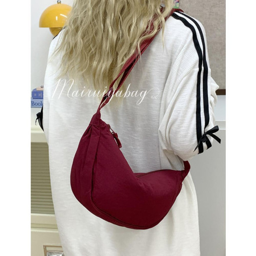 日單餃子包2025新款文藝休閒風尼龍帆布手機包斜後後背包腋下包單肩包