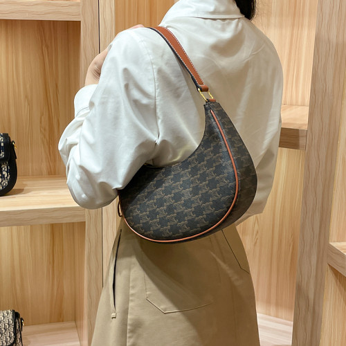 香港真皮腋下包包女2025新款秋冬月亮包半月包單肩斜背月牙包