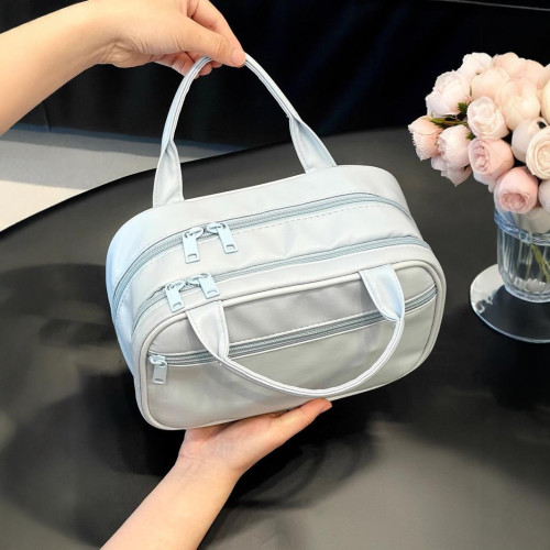 化妝包女2024新款化妝品可攜式分區收納包大容量手提防水旅行洗漱包