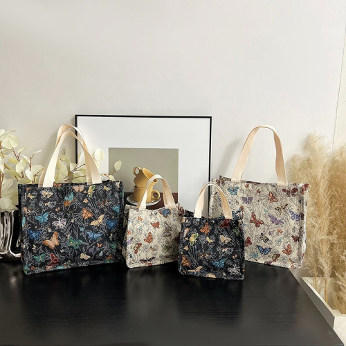 帆布包提花刺綉手提便當包媽咪包霤娃袋手提母嬰包學生通勤包女