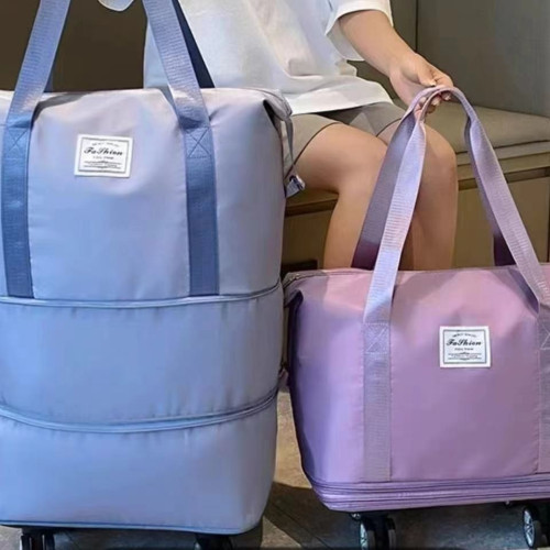 旅行包大容量萬向輪學生出差待産收納包防水乾溼分離可行李袋