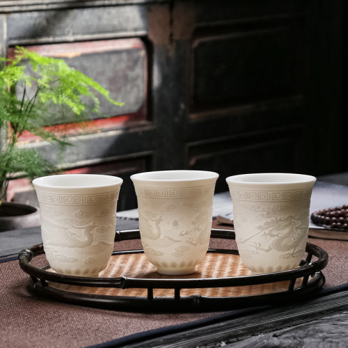 廠家直售羊脂玉浮雕陶瓷龍鳳茶盃主人盃功夫茶具品茗盃家用白瓷盃